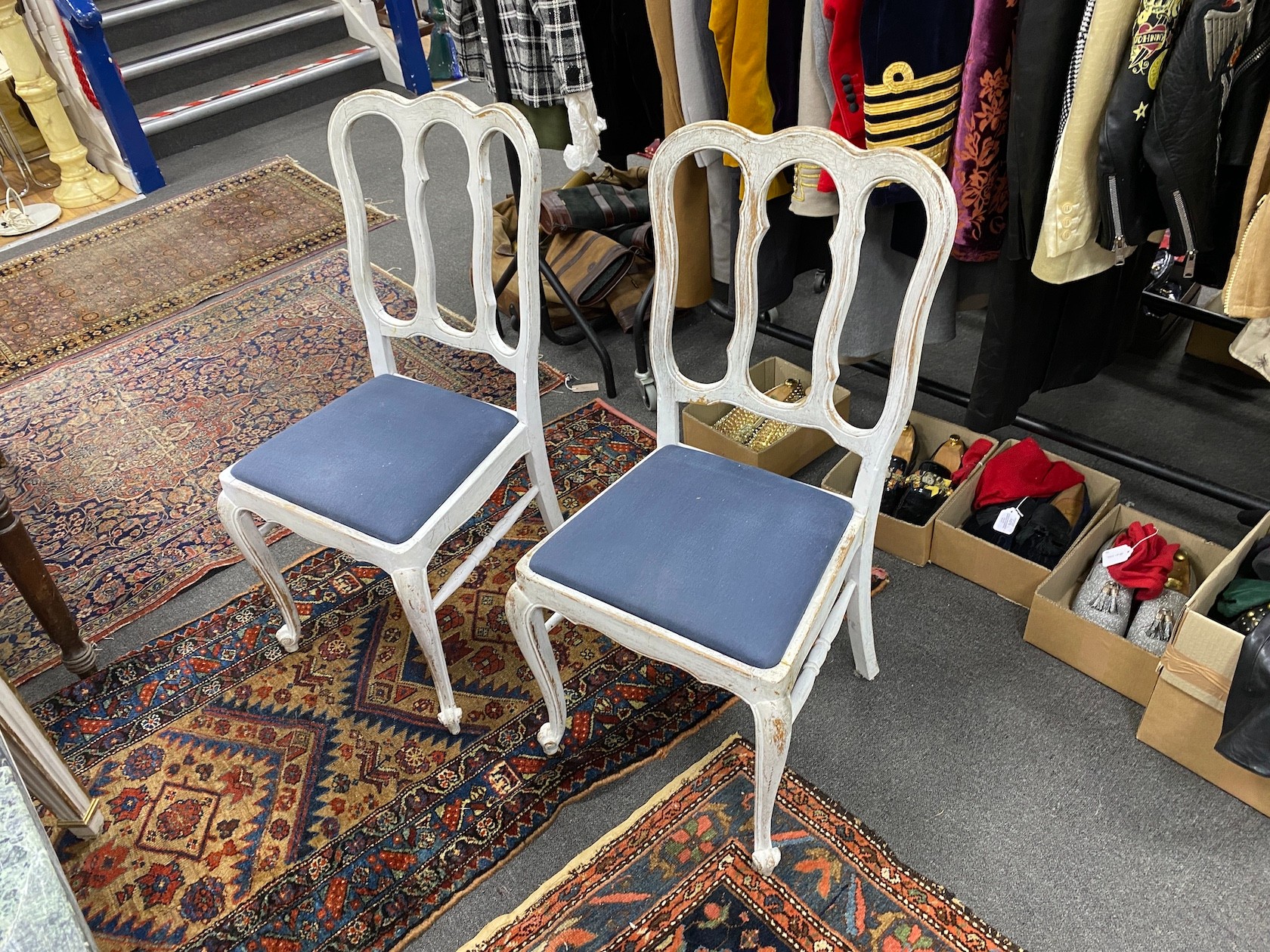 A set of four early 20th century Hepplewhite style painted dining chairs